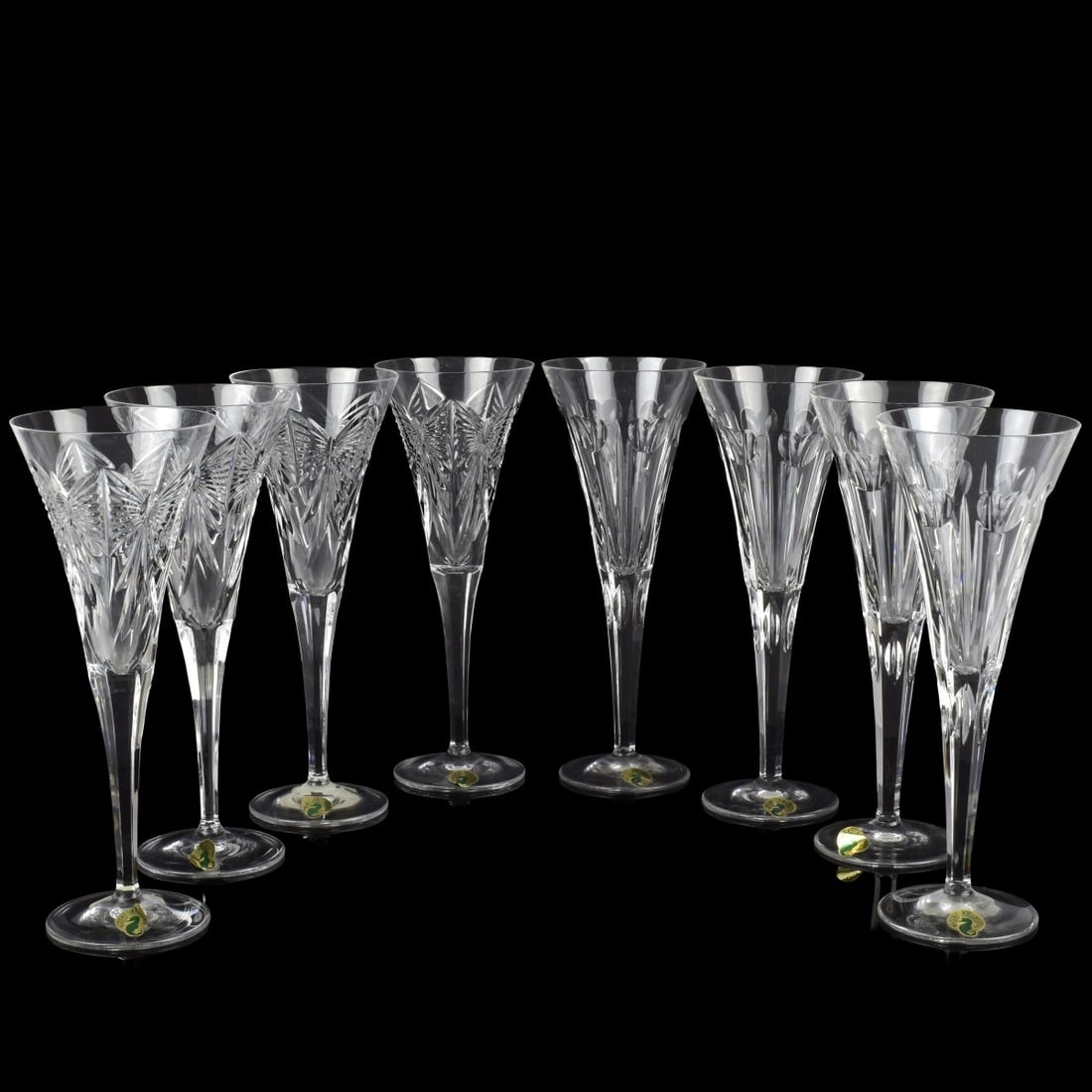 Waterford Cut Crystal Millenium Flutes: Eight (8) Waterford Cut Crystal Millenium Champagne Toasting Flutes. Consisting of four (4) each of Happiness and Love patterns. Each marked "Waterford" to the bottoms. Measures: 9-1/4" high. Kodner G