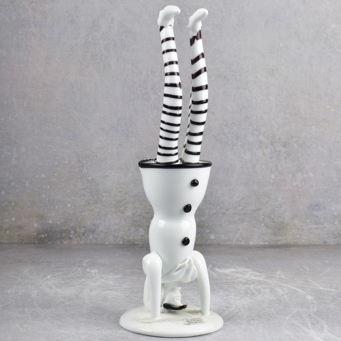 Murano Bortolotti / Rubelli Glass Jester: Vintage Murano Bortolotti and Rubelli Art Glass Jester Standing on His Head with Original Label and Partial Title Label. Measures: 12" high, base measures: 4" diameter. Kodner Galleries offers phone a