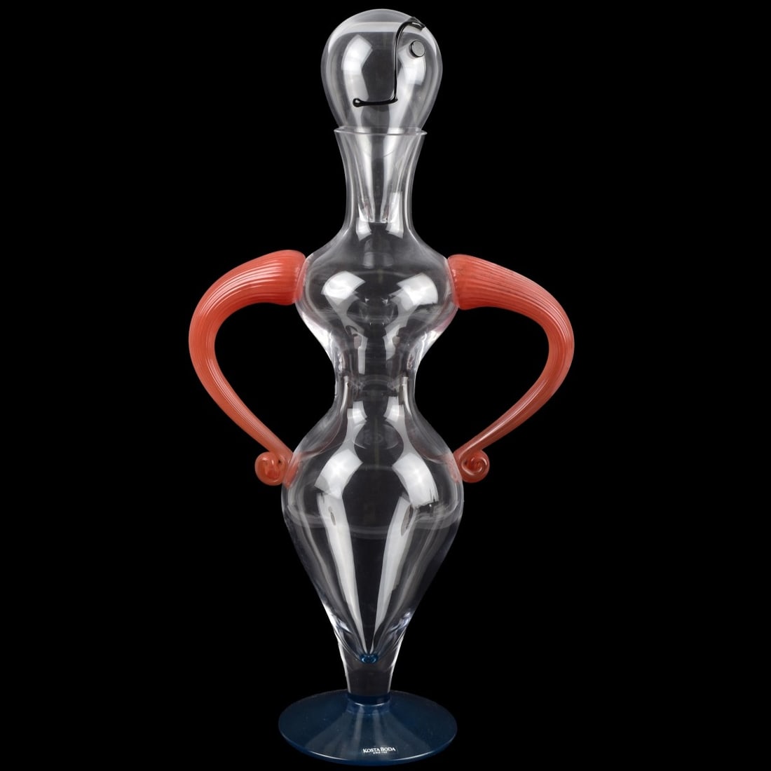 Vintage Kosta Boda Figural Bottle: Vintage Kosta Boda Figural Art Glass Bottle with Head Stopper and Applied Red Arms Designed by Kjell Engman. Original applied label, signed, numbered and dated to bottom of foot. Measures: 17-1/4" hig