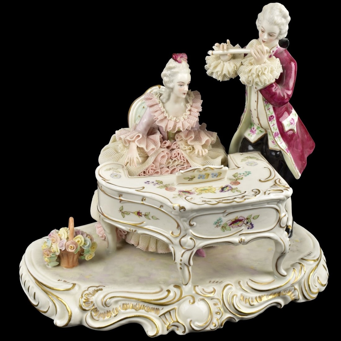 Muller Volkstedt Lace Musical Porcelain Group: Muller Volkstedt Dresden Lace Musical Porcelain Group. Marked to the bottom. Measures: 8-3/4" high, 9-1/2" wide, 6" deep. Kodner Galleries offers phone and absentee bidding at a low, flat 21% buyer’