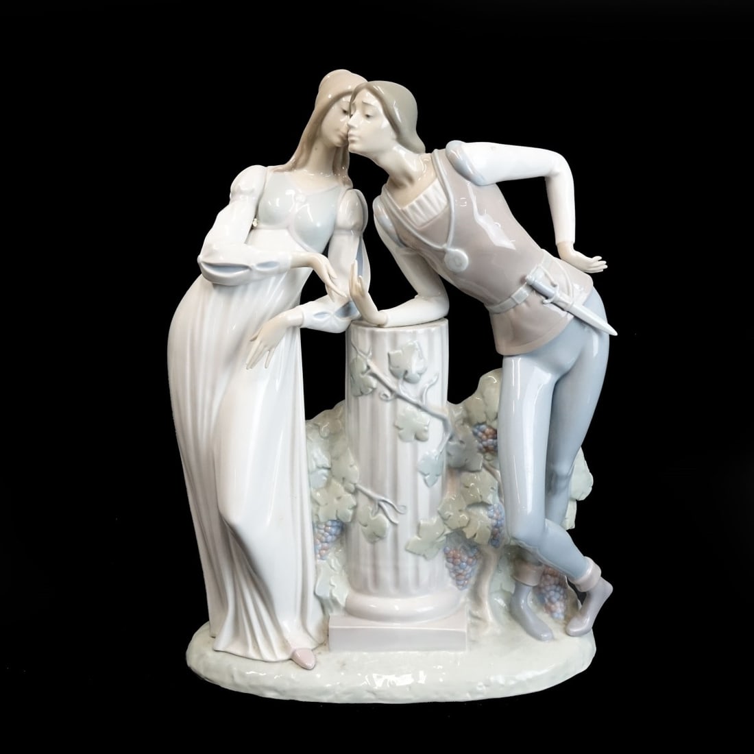 Lladro Figurine "Romeo and Juliet": Lladro "Romeo and Juliet" Glazed Porcelain Figurine. Signed. Measures 17" x 13" x 5-1/4". Kodner Galleries offers phone and absentee bidding at a low, flat 21% buyer’s premium without surcharge or h