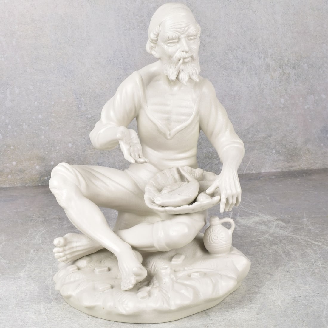 Vintage Dresden Bisque Fisherman: Vintage Dresden German White Bisque Fisherman with Pipe. Properly marked to the underside. Measures: 10-3/4" high, 7-3/4" wide, 7" deep. Kodner Galleries offers phone and absentee bidding at a low, fl