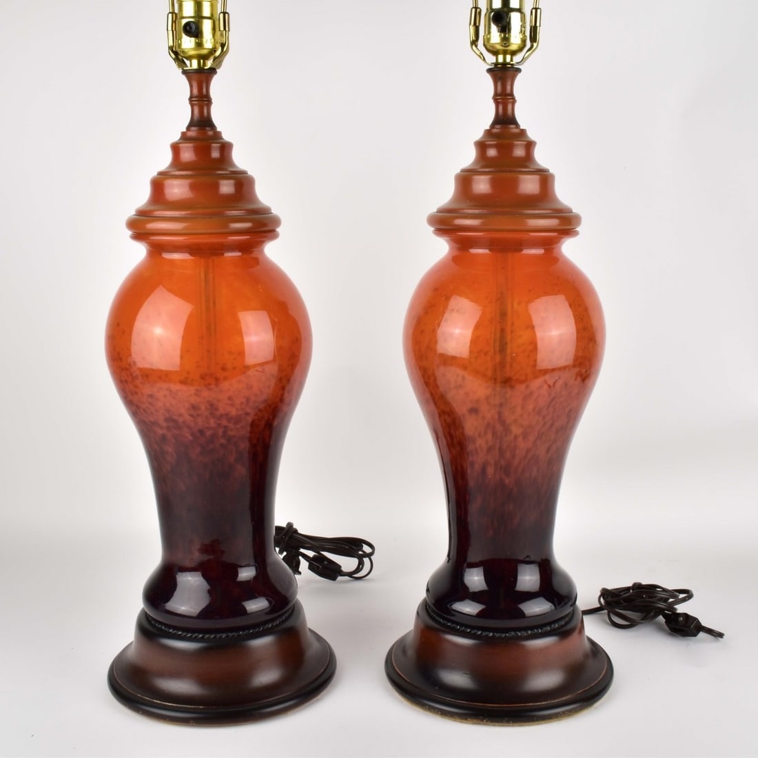 Charles Schneider, French (1881-1953): Charles Schneider, French (1881-1953) Pair of Conical Shaped Lamps in Mottled Yellow and Bright Orange Glass on Violet-Black Footed Bases. Fitted on round wood bases and floral finials. Signed "Schnei