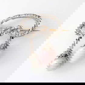 Edwardian Conch Pearl 14K Brooch: Edwardian Conch Pear, Natural Gray Pearl and Diamond Brooch Set in 14K White Gold and Silver. Natural conch pearl measures: 12 x 9mm. Accented with approximately 1.25 carats of rose and antique cut di