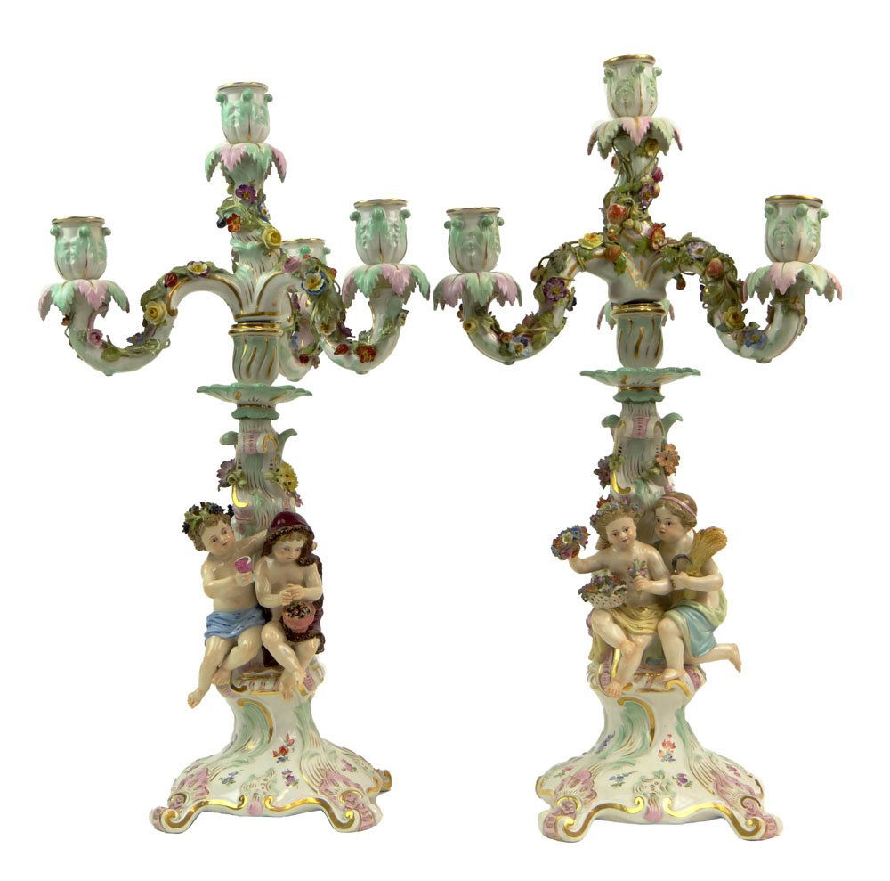 Pair of 20th Century Meissen Painted and Gilt Porcelain: Pair of 20th Century Meissen Painted and Gilt Porcelain Candelabra with Applied Flower Decoration and Figural Putti to Stems. Blue Crossed Swords Mark. Very Minor Typical Losses to Applied Flowers Oth
