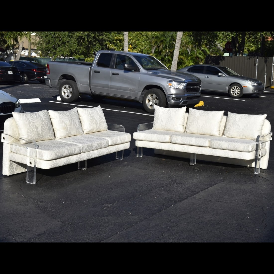 Vladimir Kagan Lucite Sofas: Pair of Vintage Vladimir Kagan Lucite Sofas. Measures; 82" wide, 31" high, 32" deep. Kodner Galleries offers phone and absentee bidding at a low, flat 21% buyer’s premium without surcharge or hidden