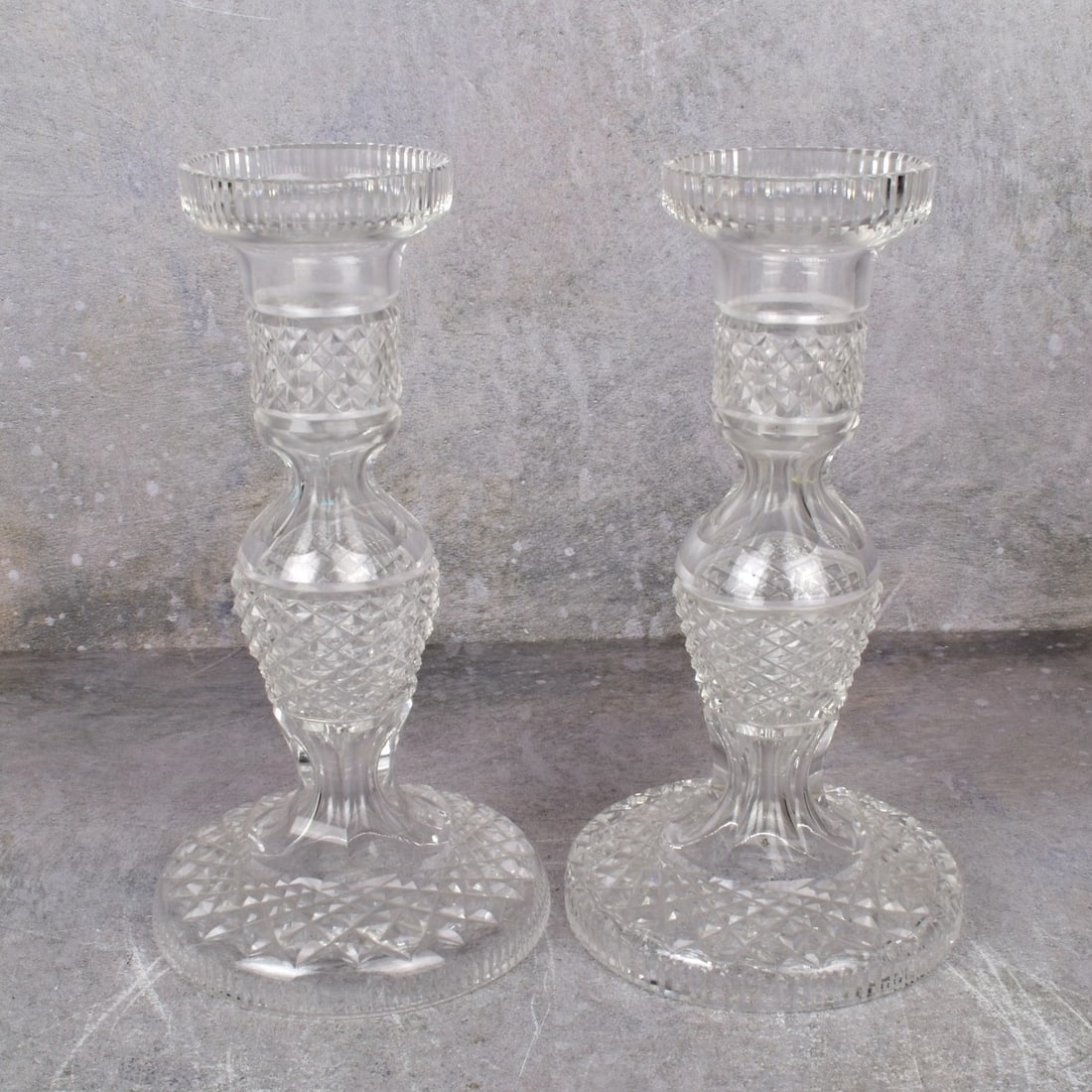 Waterford Crystal "Alana" Pattern Candlesticks: Pair Waterford Crystal "Alana" Pattern Candlesticks Having Cross Hatch Cuts and Circular Feet. Acid etched "Waterford" to the bottoms. Measures: 7-1/2" H, base measures: 4" Dia. Kodner Galleries offer
