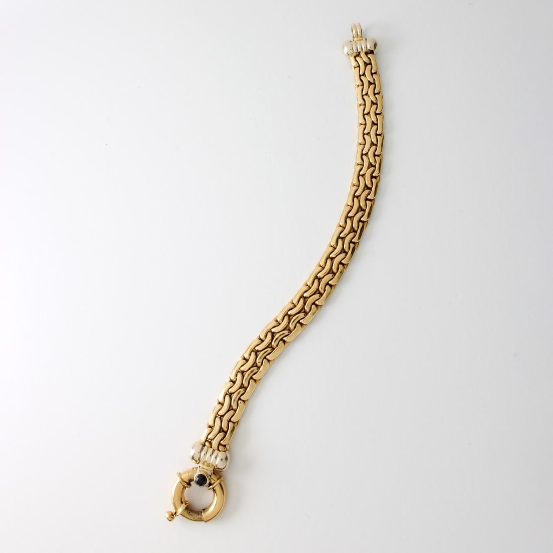 18K Bracelet: Vintage Italian 18 Karat Yellow Gold Link Bracelet with Small Cabochon Black Onyx Accent to Clasp. Stamped 750 to clasp. Measures 7-3/4" L, 1/2" W. Approx. weight: 26.65 grams. Kodner Galleries offers