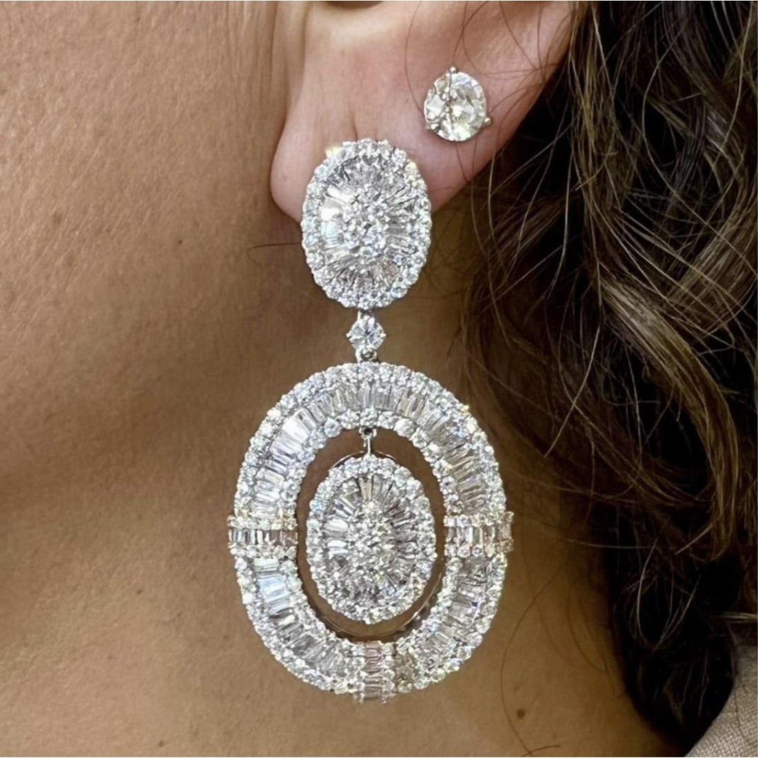 Diamond and 18K Earrings: Diamond and 18 Karat White Gold Earrings. Set throughout with approx. 14.65 carat five hundred eighty-one round and baguette cut diamonds, F-G color, VVS-VS clarity. Measure 2-1/4" L. Approx. weight: