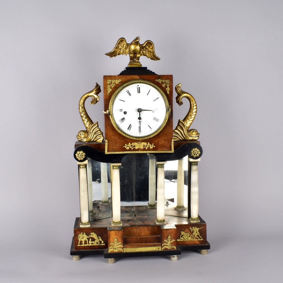Biedermeier Portico Clock: Biedermeier Partial Ebonized and Alabaster Mounted Mahogany Portico Silk Thread Mantle Clock. Circa 1830. Measures 23-3/4" H, 14" W, 7-1/4" D. Kodner Galleries offers phone and absentee bidding at a l