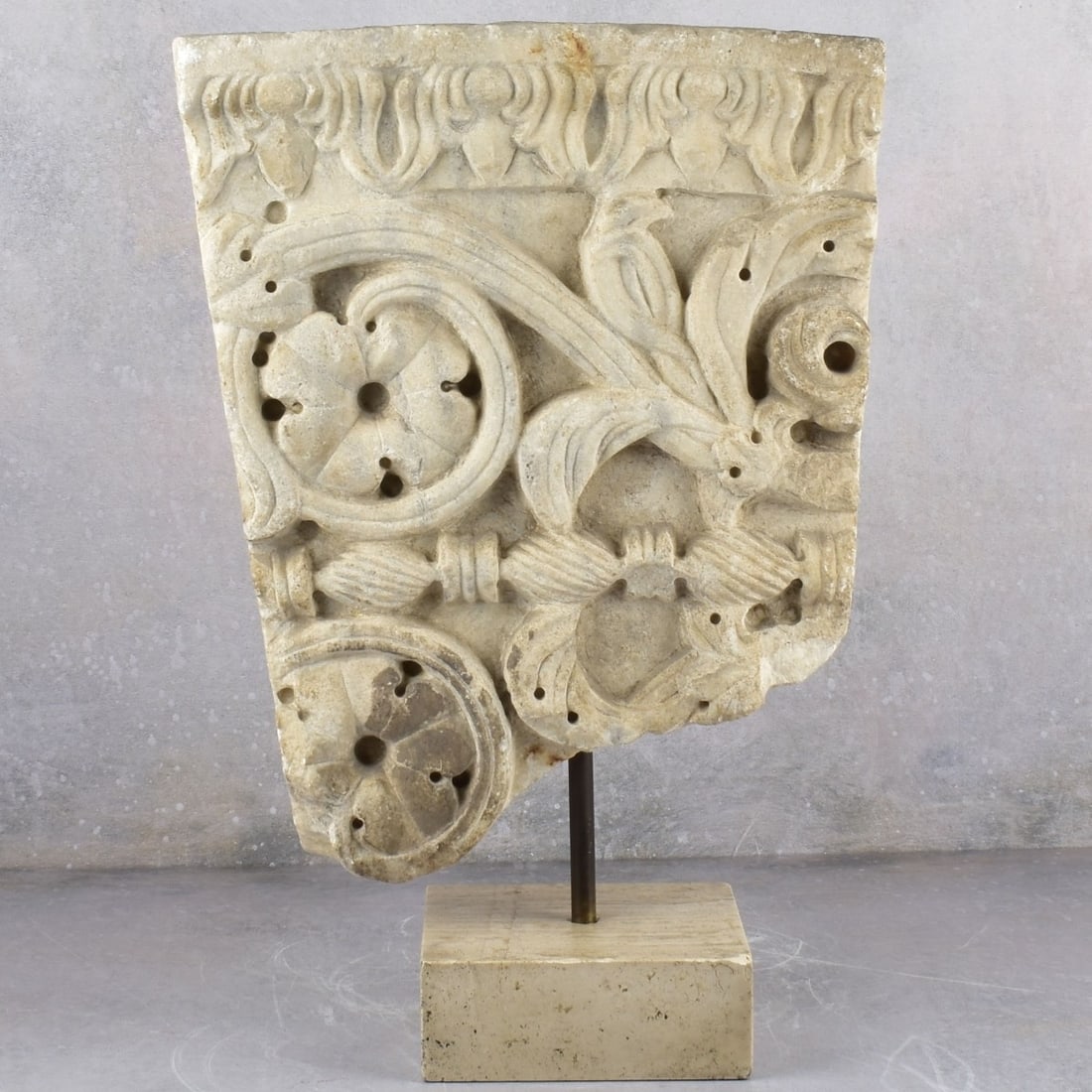 Antique Marble Sculpture of a Structural Frieze: Antique Marble Portion of a Structural Frieze with Rosette Medallions and Floral Motif with a Stone Base. Frieze measures: 16" High,12-1/2" Wide, 3-3/8" Deep, base measures: 2-1/4" High, 4-1/8" Square