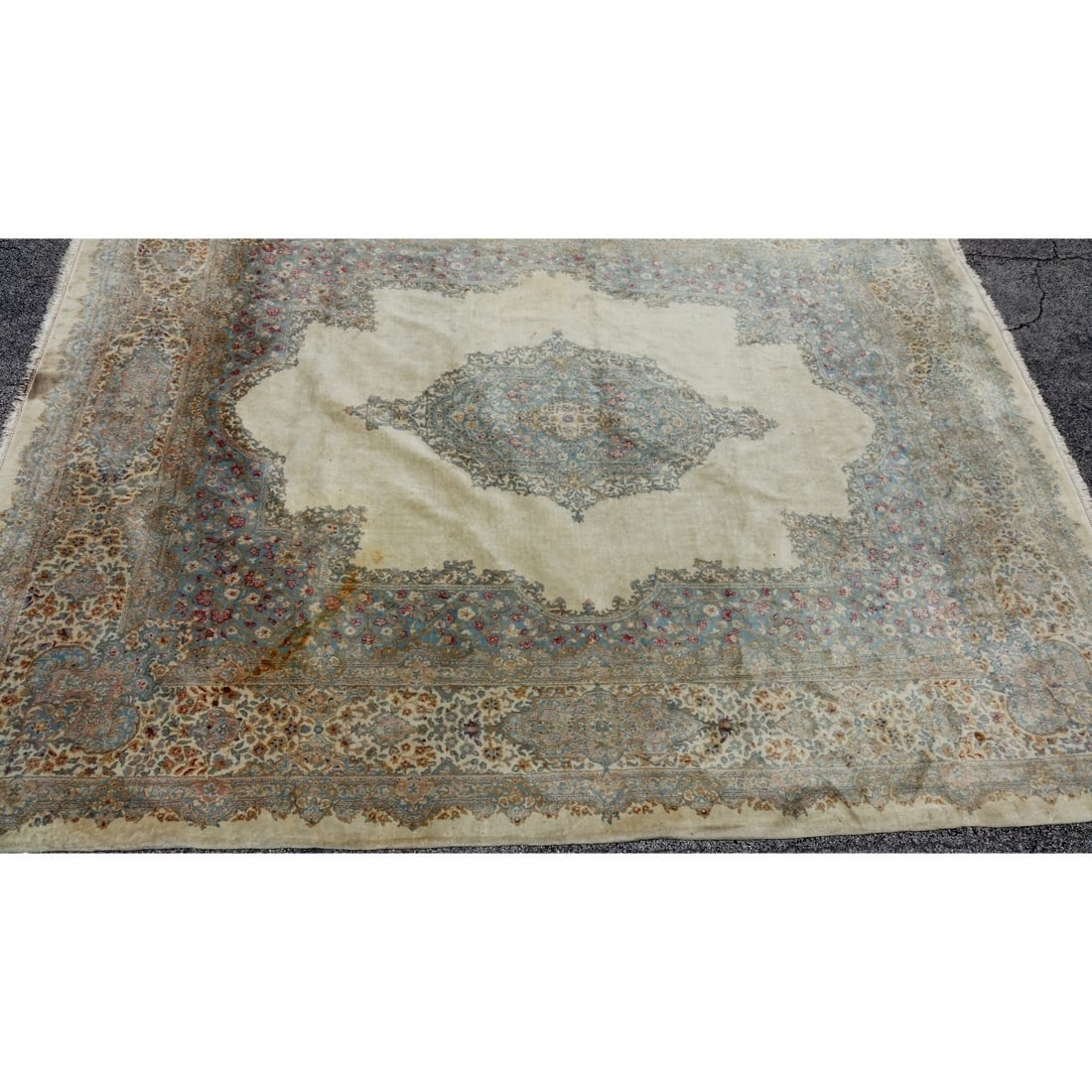 Semi Antique Persian Kerman Rug: Large Semi Antique Persian Kerman Rug. Beige ground with floral pattern with center medallion. Tag attached en verso. Measures 187" H x 145" W. Kodner Galleries offers phone and absentee bidding at a
