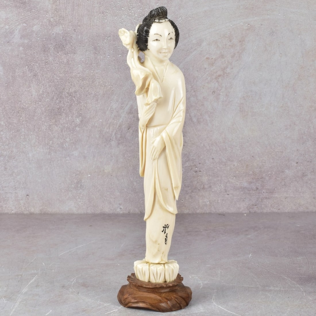 Carved Chinese Guanyin: Carved Chinese Guanyin Full Length Figurine Holding a Flowering Branch. Late 20th century. Signed. Figure measures: 8-3/4" high, 1-1/2" wide, 1-1/4" deep, base measures: 3/4" high. Kodner Galleries of