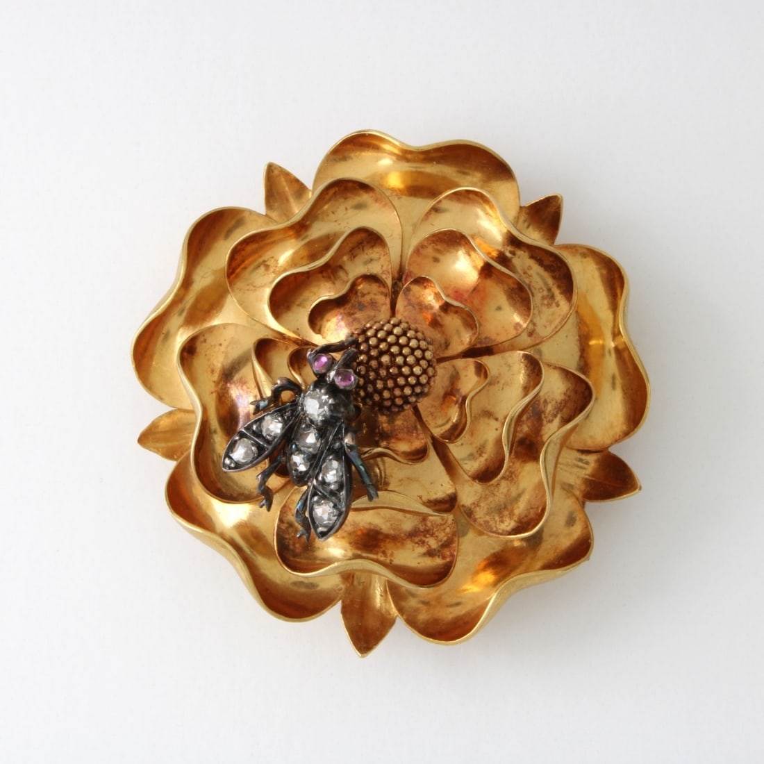 18K Flower Pin with Fly: Antique Large 18 Karat Yellow Gold Flower Pin with Silver Fly accented with Small Mine Cut Diamonds and Ruby Eyes. Maker's mark to verso (unidentified). Flower measures 1-5/8" diameter. Approx. weight