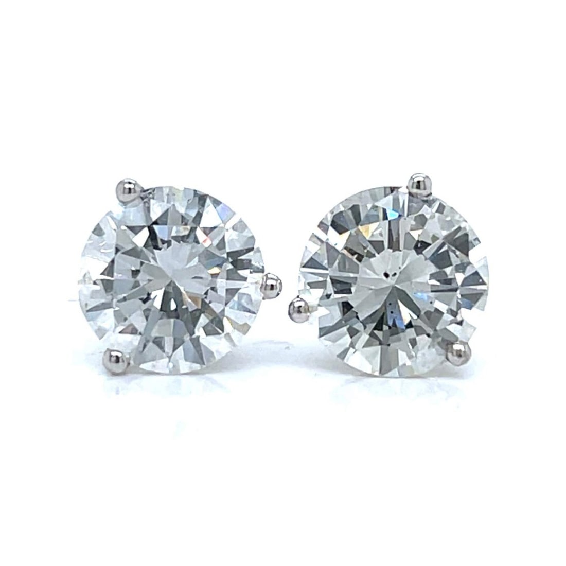 Diamond and 14K Ear Studs: Approx. 4.84 Carat TW Round Brilliant Cut Diamond and 14 Karat White Gold Ear Studs. Set with a 2.49 carat diamond and a 2.35 carat diamond, F-G color, SI1-SI2 clarity. Approx. total weight: 2.9 grams