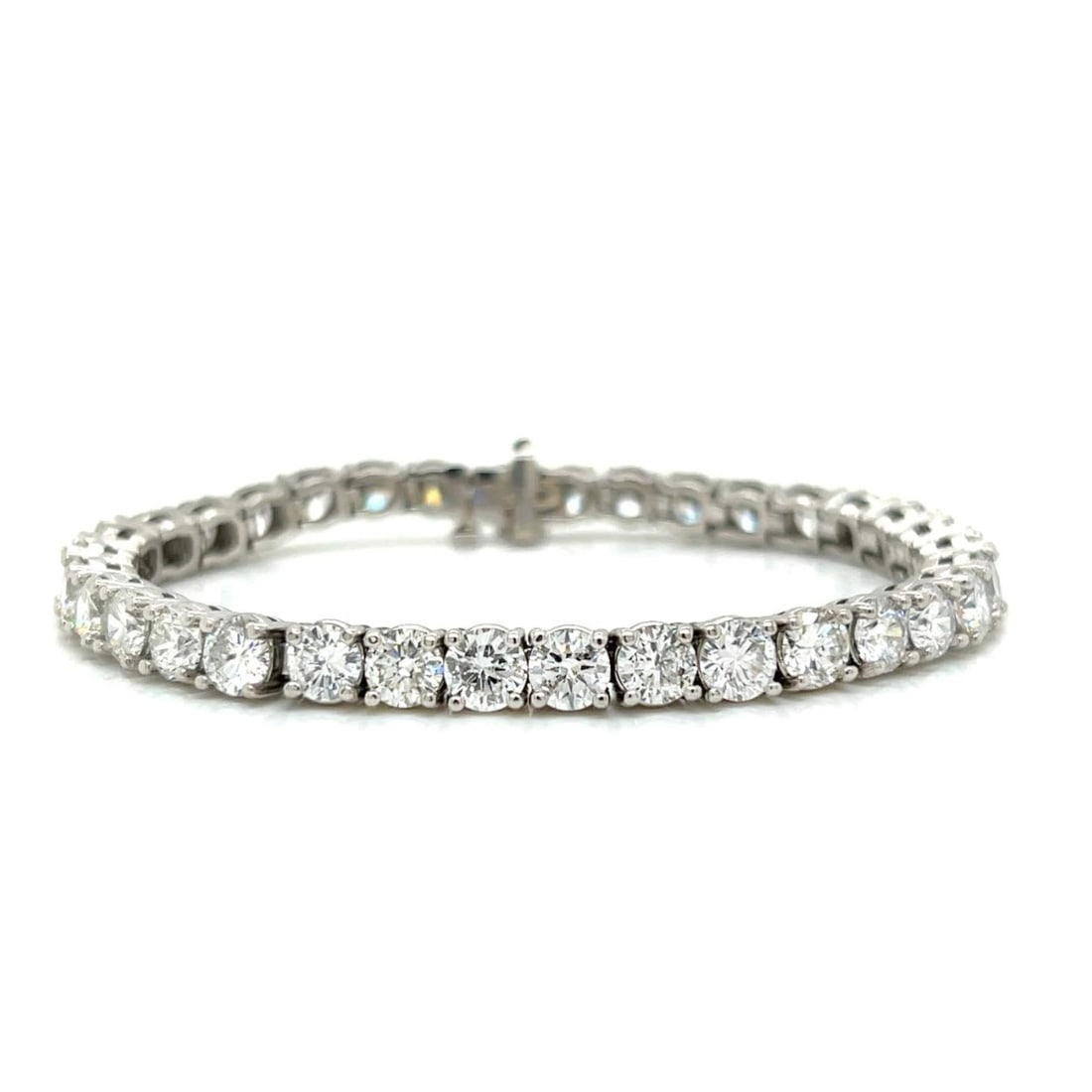 Diamond and Platinum Bracelet: Vintage Approx. 19.0 Carat Round Brilliant Cut Diamond and Platinum Tennis Bracelet. Diamonds G-I color, VS1-Si2 clarity. Measures 7" L. Approx. weight: 40.7 grams. Kodner Galleries offers phone and