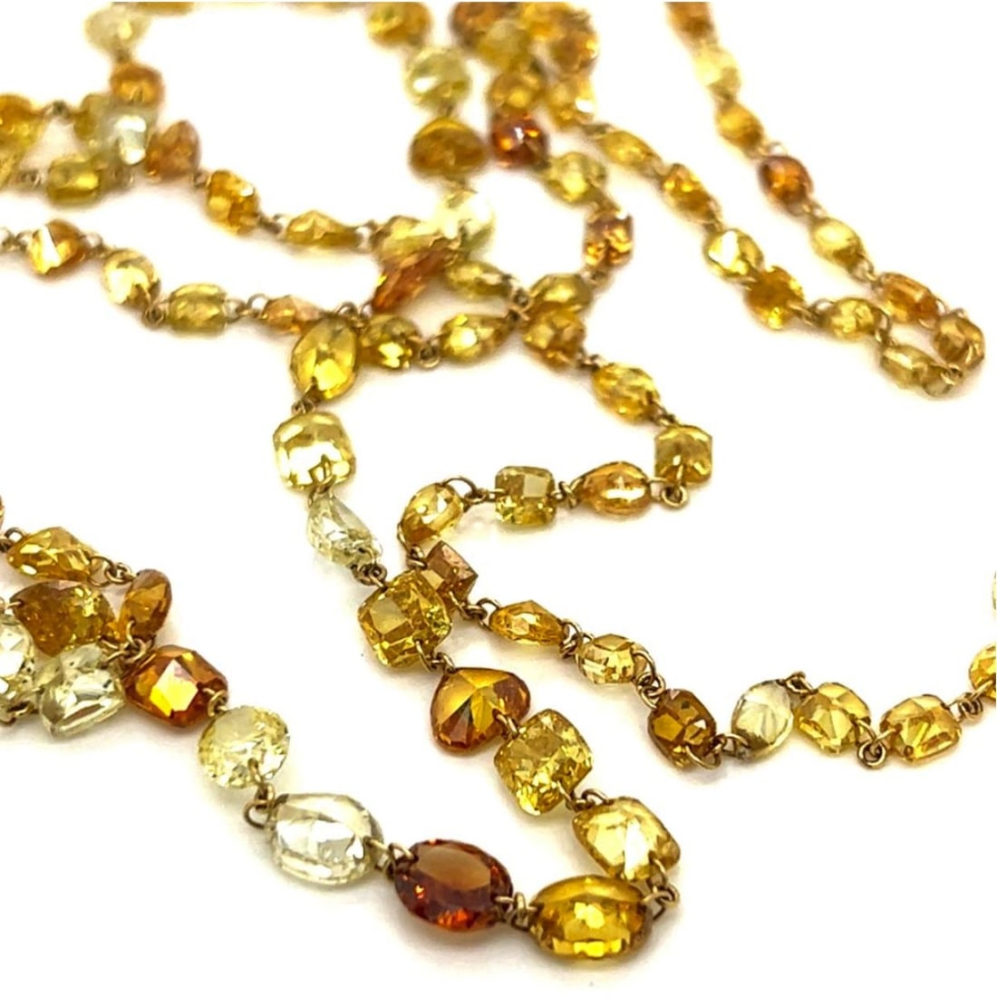 Diamond and 18K Necklace: Approx. 43.06 Carat TW One Hundred Seventy-eight Mixed Cut Natural Color Diamond and 18 Karat Yellow Gold Necklace. Diamonds VS1-SI1 clarity. Measures 31" L. Approx. weight: 11.7 grams. Kodner