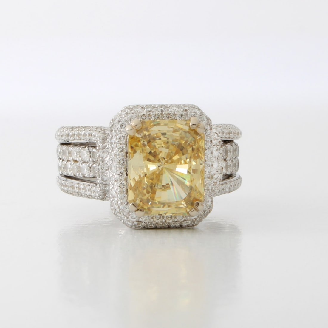 Diamond, CZ and 18K Ring: Fine Quality Approx. 4.0 Carat TW Pave Set Round Brilliant Cut Diamond, Emerald Cut Fancy Vivid Yellow Cubic Zirconia and 18 Karat White Gold Engagement Ring. Diamonds E-F color, VS1-VS2 clarity.
