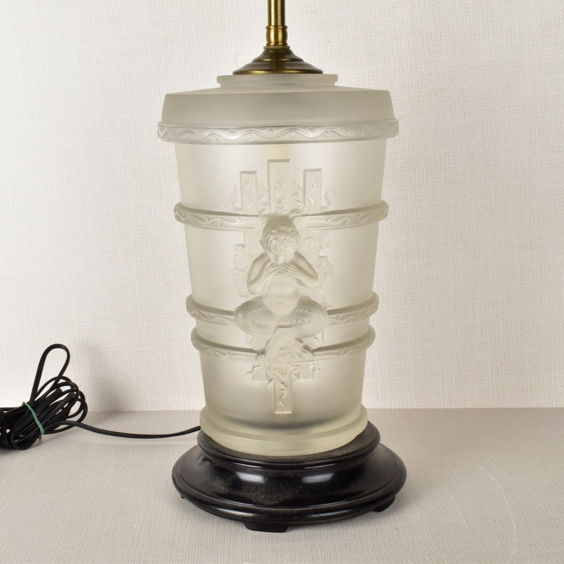 Lalique Faune Crystal Lamp: Lalique "Pan Faune" Crystal Two Light Lamp in Clear and Frosty Glass with Molded Faune to Each Side, Mounted on a Gun Metal Base. Designed by Marc Lalique, circa 1950. Crystal portion measures: