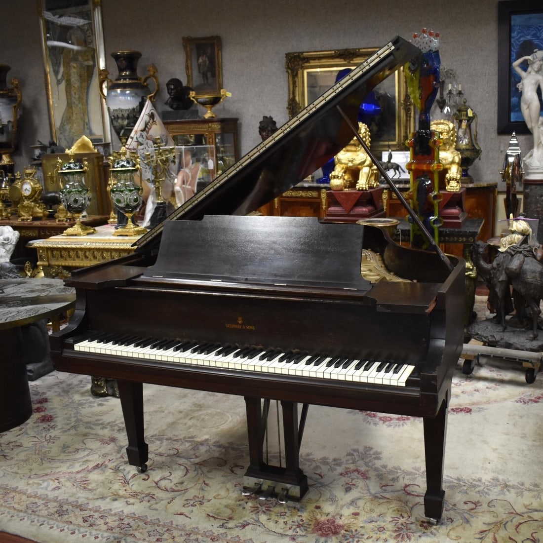 Steinway & Sons Baby Grand Piano: Steinway & Sons Baby Grand Piano. Good sound. Circa 1950. Plate with cast "1/22.N 603". Measures: 67-1/2" Long, 56" Wide, 38" High. We Will Not Ship This Item Outside of the State of Florida. Anyone H