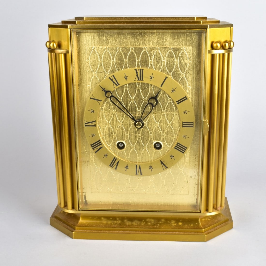 Vintage Gubelin Brass Mantle Clock: Vintage Gubelin Brass Mantle Clock. Marked on the movement. Eleven jewel. Swiss made. Measures 10-3/4" x 9-1/2" x 4-3/4". Please note the gallery does not warranty the running condition of clocks. Kod