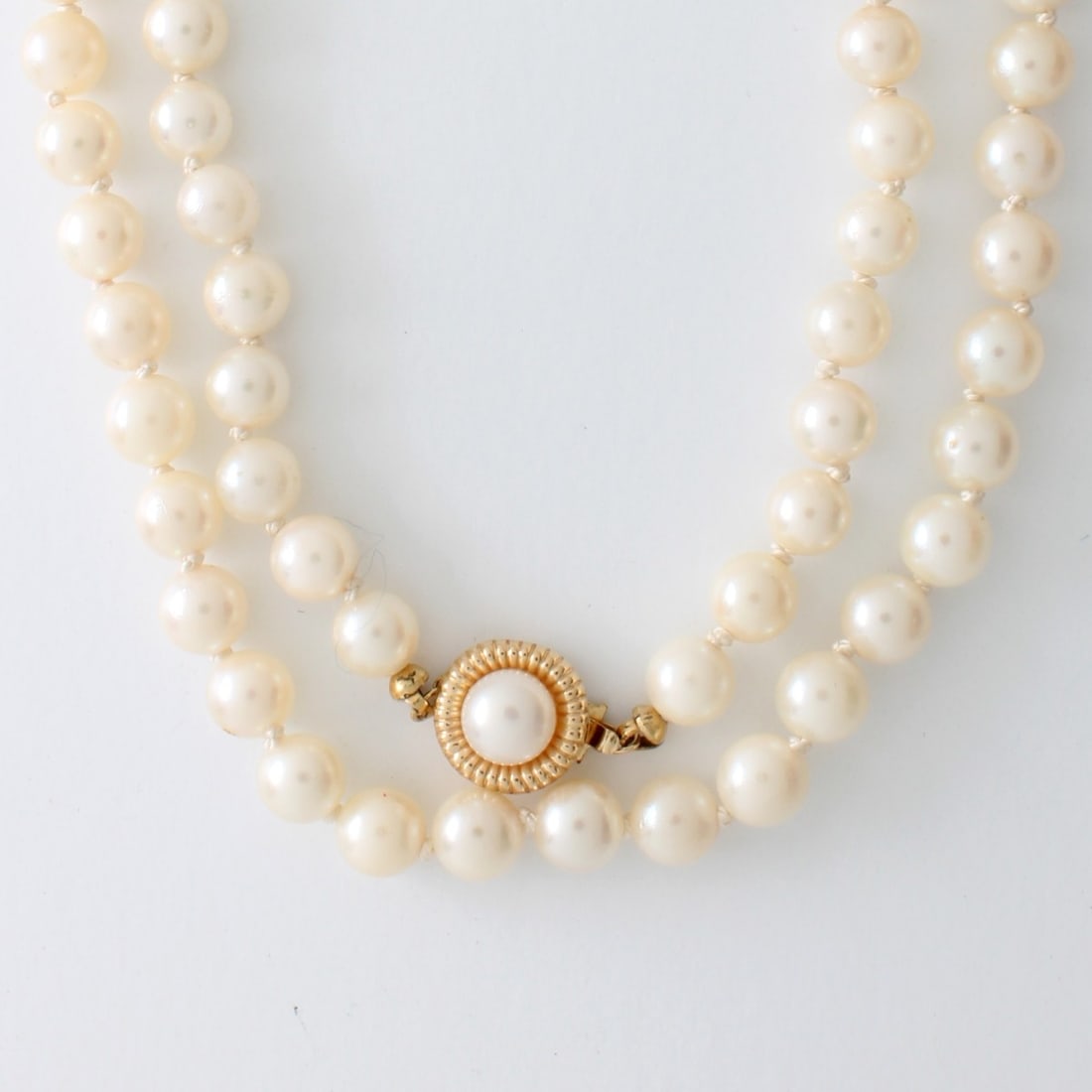 Pearl and 14K Necklace: Fine Vintage 6.0-6.3mm Pearl Necklace with Pearl and 14 Karat Yellow Gold Clasp. Pearls with good luster and polish. Necklace measures 30" L. Approx. weight: 39.33 grams. Kodner Galleries offers