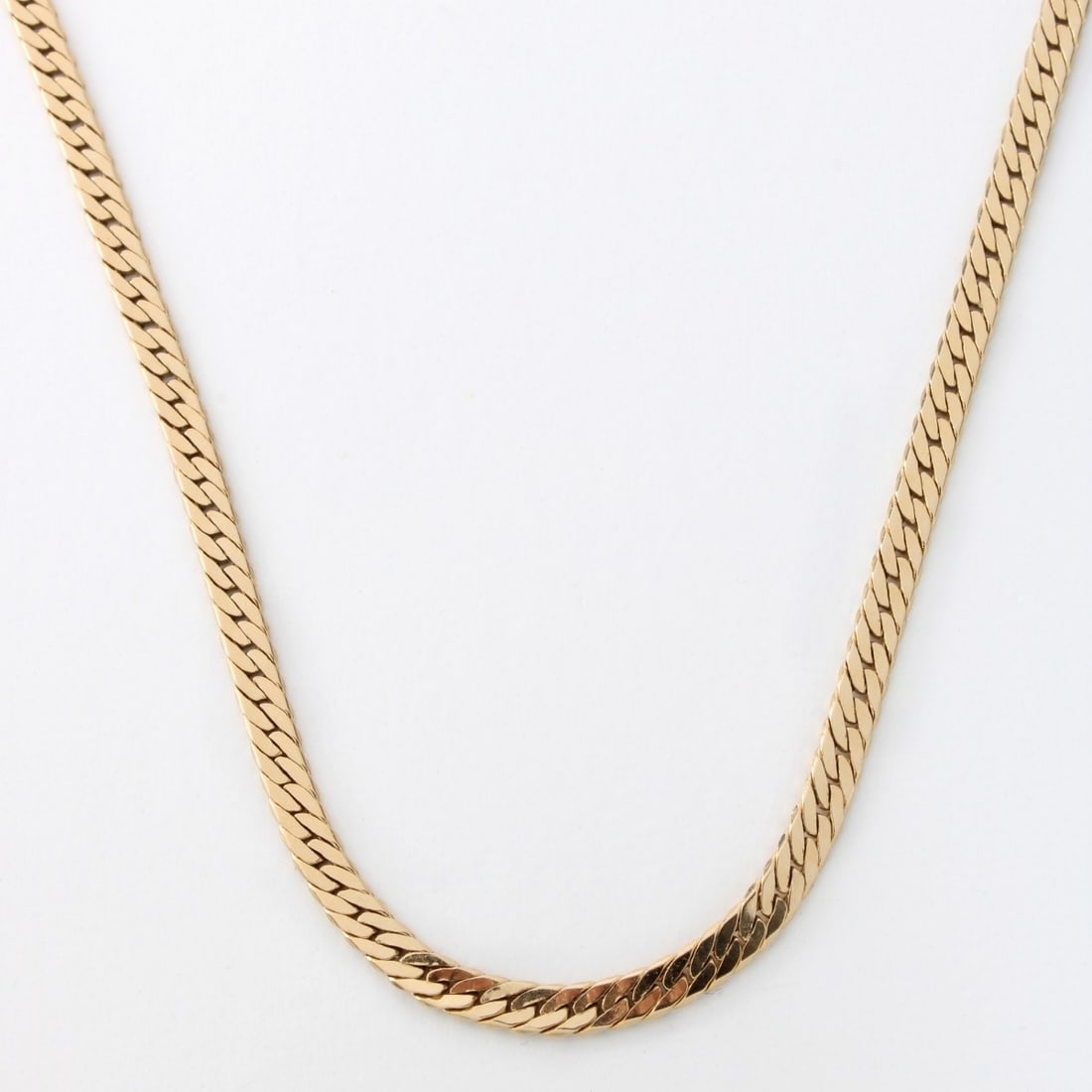 14K Necklace: Vintage 14 Karat Yellow Gold Herringbone Link Necklace. Clasp stamped 14K. Measures 16" L, 3mm W. Approx. weight: 8.23 grams. Kodner Galleries offers phone and absentee bidding at a low, flat 21% buye