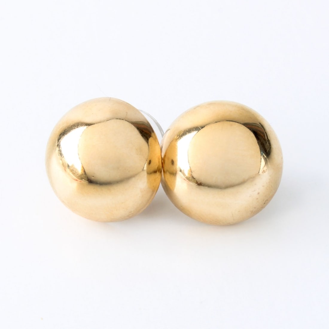14K Earrings: Vintage 14 Karat Yellow Gold (hollow) Dome Earrings. Measure 9/16" diameter. Approx. weight (without post backs): 2.74 grams. Kodner Galleries offers phone and absentee bidding at a low, flat 21%