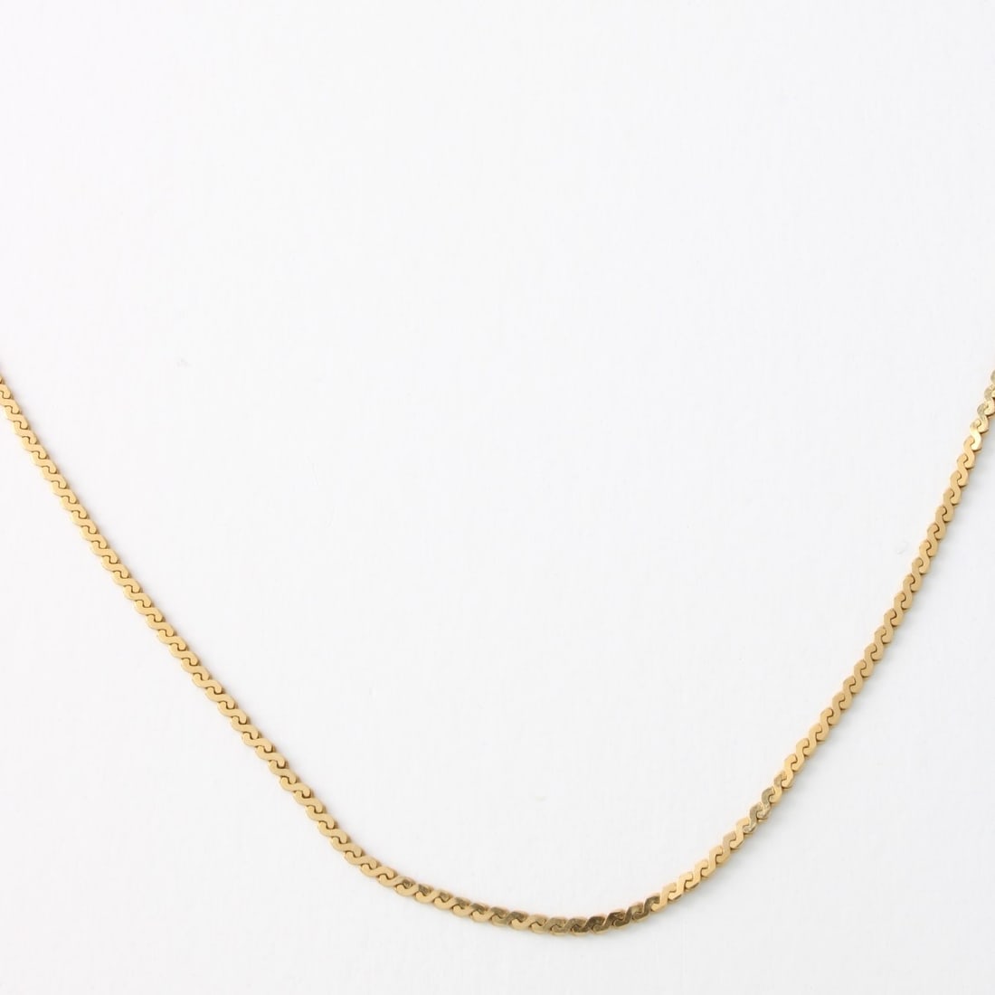 14K Necklace: Vintage 14 Karat Yellow Gold Herringbone Link Necklace. Clasp stamped Italy 585. Measures 16" L, 1mm W. Approx. weight: 2.23 grams. Kodner Galleries offers phone and absentee bidding at a low, flat