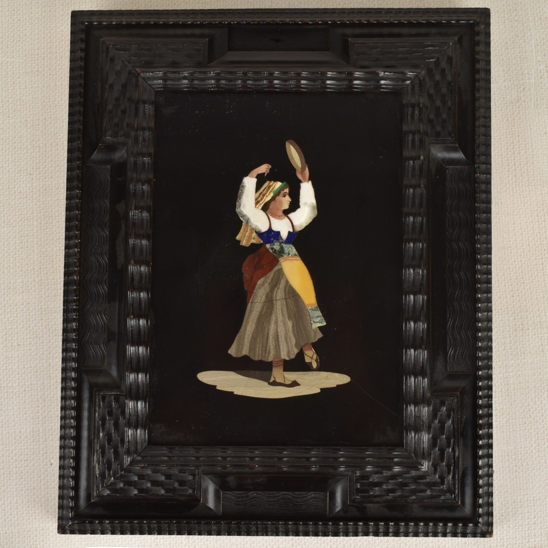 Italian Pietra Dura Plaque: Italian Pietra Dura Plaque of a Lady Holding a Tambourine and Dancing. Circa 1930. Viewing area measures: 8" H, 5-3/4" W, frame measures: 13" H, 10" W. Kodner Galleries offers phone and absentee