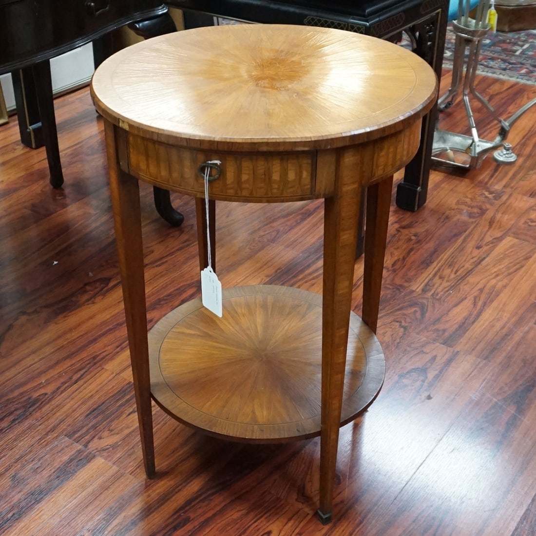 Round Side Table Mid 20C Louis XVI Style: Mid 20th Century Louis XVI Style Marquetry Inlaid Round Side Table. Features a single drawer, lower shelf stretcher, and stands on tapering legs. Measures 28-1/4" x 19-3/4". Kodner Galleries offers