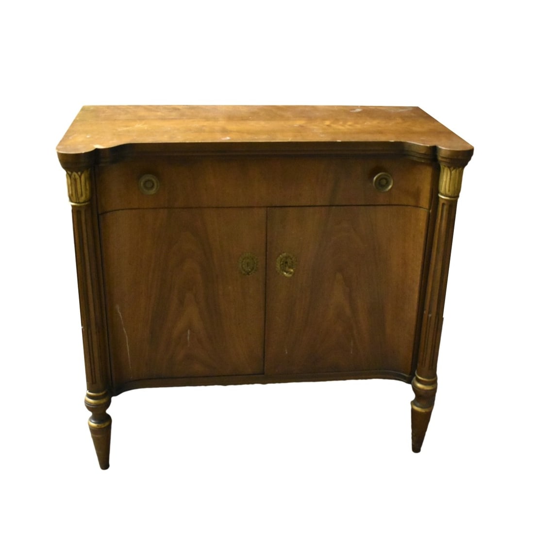Baker Furniture Walnut Cabinet: Baker Furniture Walnut Neo-Classical Cabinet With Two Doors and One Slide Out Drawer Supported on Four Spindle Legs. Original oval label attached to inside of pull out drawer. Measures: 32-3/4" H, 35-