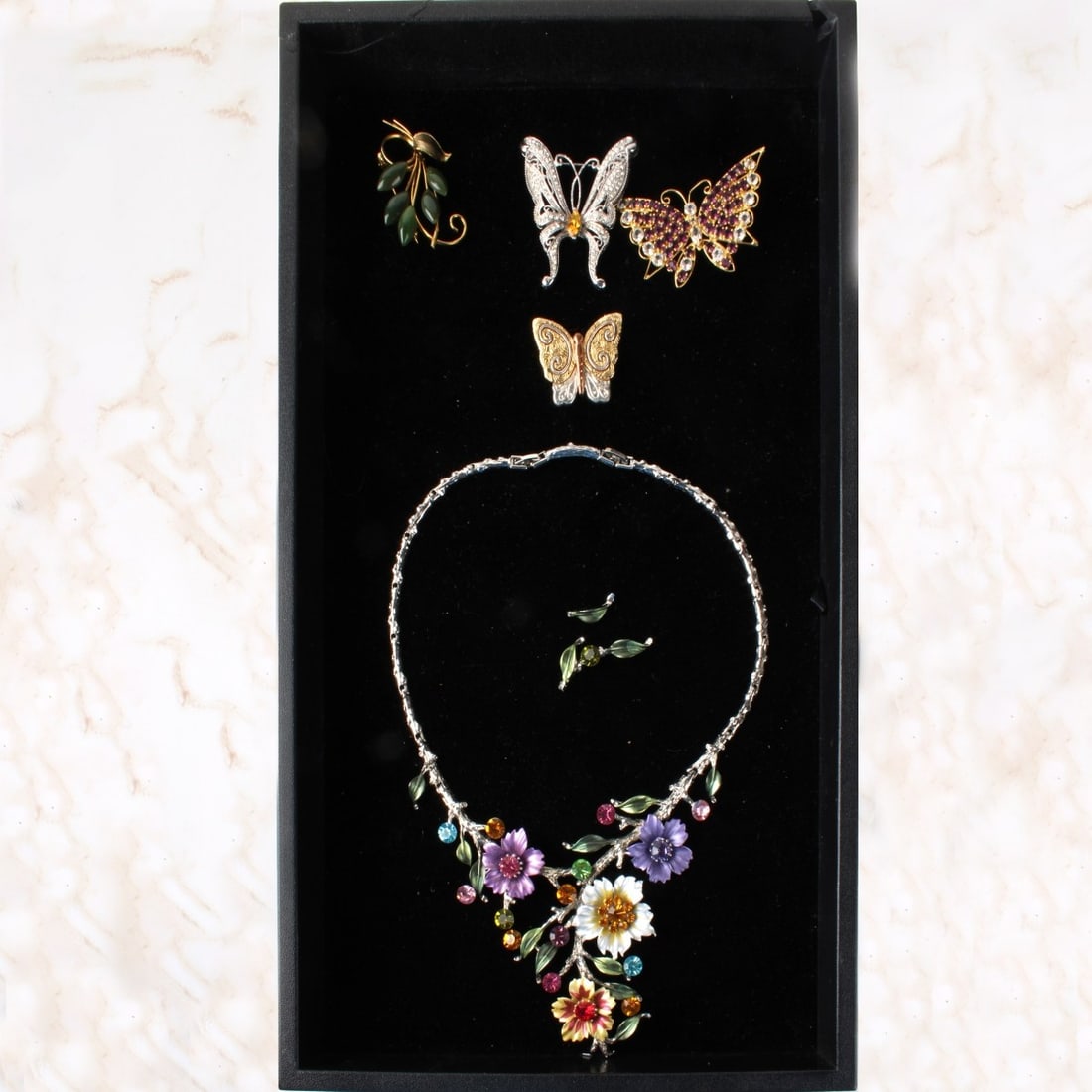 Tray Lot of Vintage Fashion Jewelry: Tray Lot of Vintage Fashion Jewelry. To include one (1) enameled necklaces, four (4) pins. Some pieces accented with faux diamonds and enamels. Kodner Galleries offers phone and absentee bidding at a