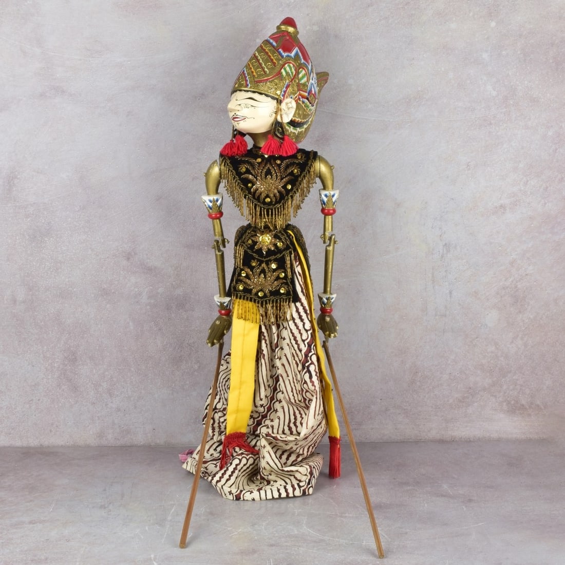 Balinese Rod Puppet: Balinese Rod Puppet Dressed in Elaborate Customary Clothing. Body height measures: 24" long. Kodner Galleries offers phone and absentee bidding at a low, flat 21% buyer’s premium without surcharge