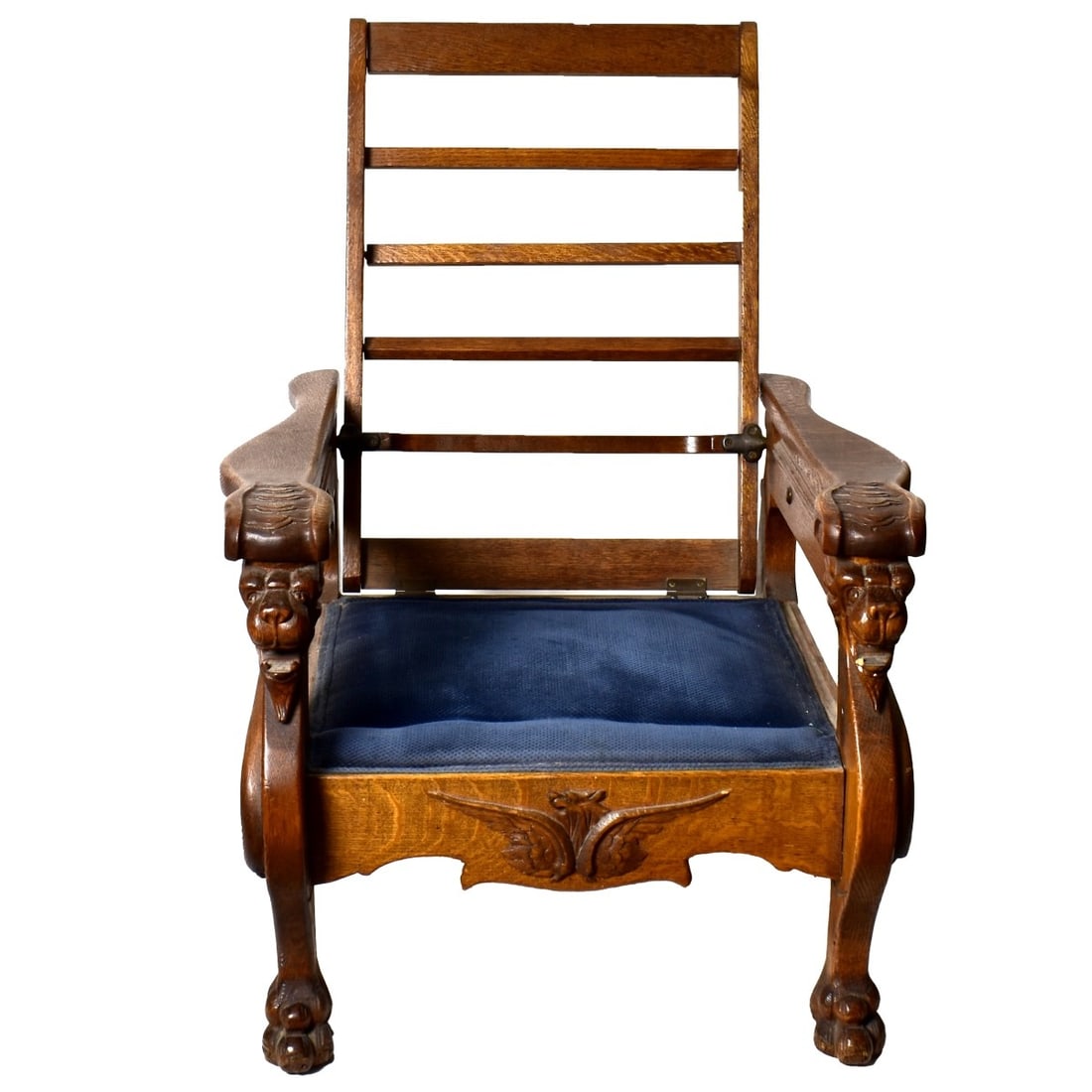 Antique Morris Recliner Chair: Antique Morris Oak Recliner Chair with Carved Gryphon Head Arm Rests and Stands Paw Feet. Measures 38-1/4" x 29" x 35", 13-1/2" seat height. Kodner Galleries offers phone and absentee bidding at a