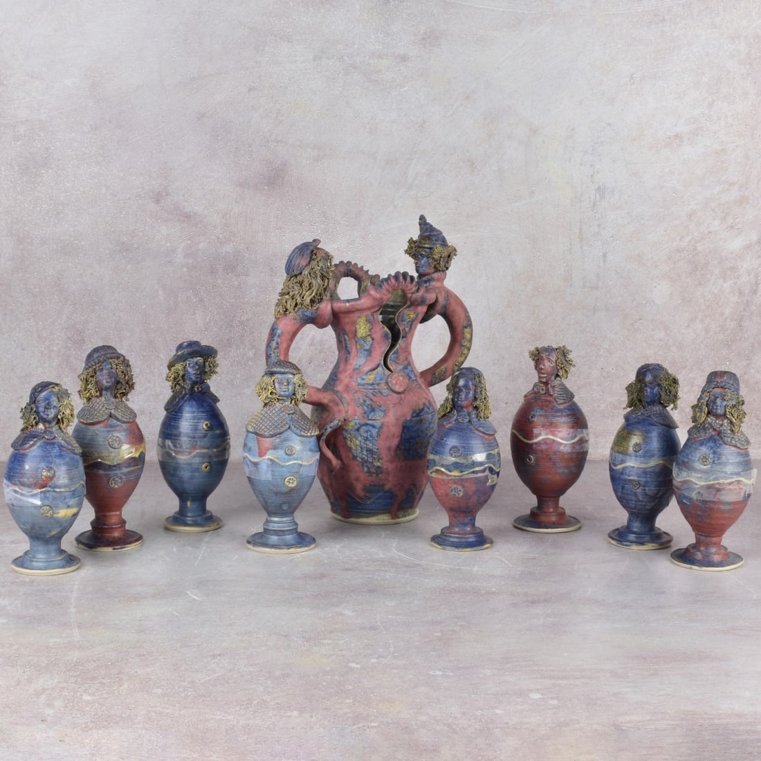 Michael Kennedy Painted Pottery: Michael Kennedy Collection of Eight (8) Painted Pottery Figural Eggs and One (1) Vase. All with incised marks. Vase measures: 10-3/4" high, 8" wide, 4-1/2" wide, eggs measure: 6-3/4" high, 2-1/2"