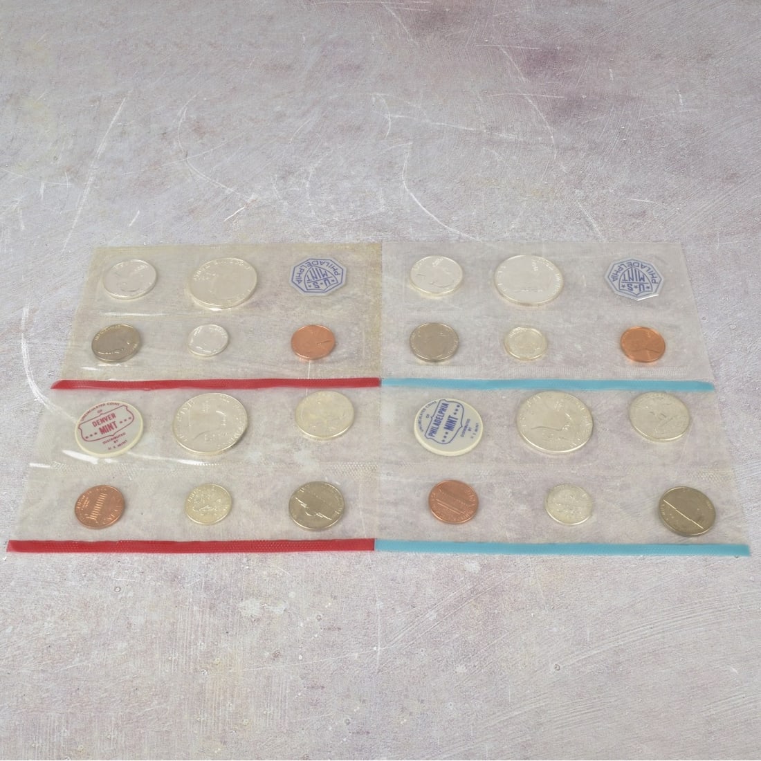 US Mint Proof Sets: Four (4) US Mint Proof Sets. Consisting of one (1) 1962 and three (3) 1963 sets with each having five (5) coins per set with mixed denominations and struck at various mints. Uncirculated in their