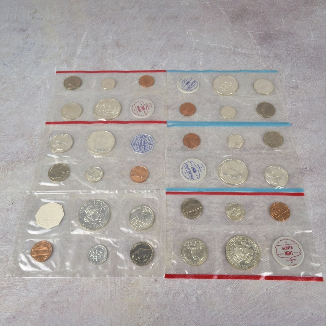 US Mint Proof Sets: Six (6) US Mint Proof Sets. Consisting of six (6) 1964 setts with each having five (5) coins per set with mixed denominations and struck at various mints. Uncirculated in their original packaging.