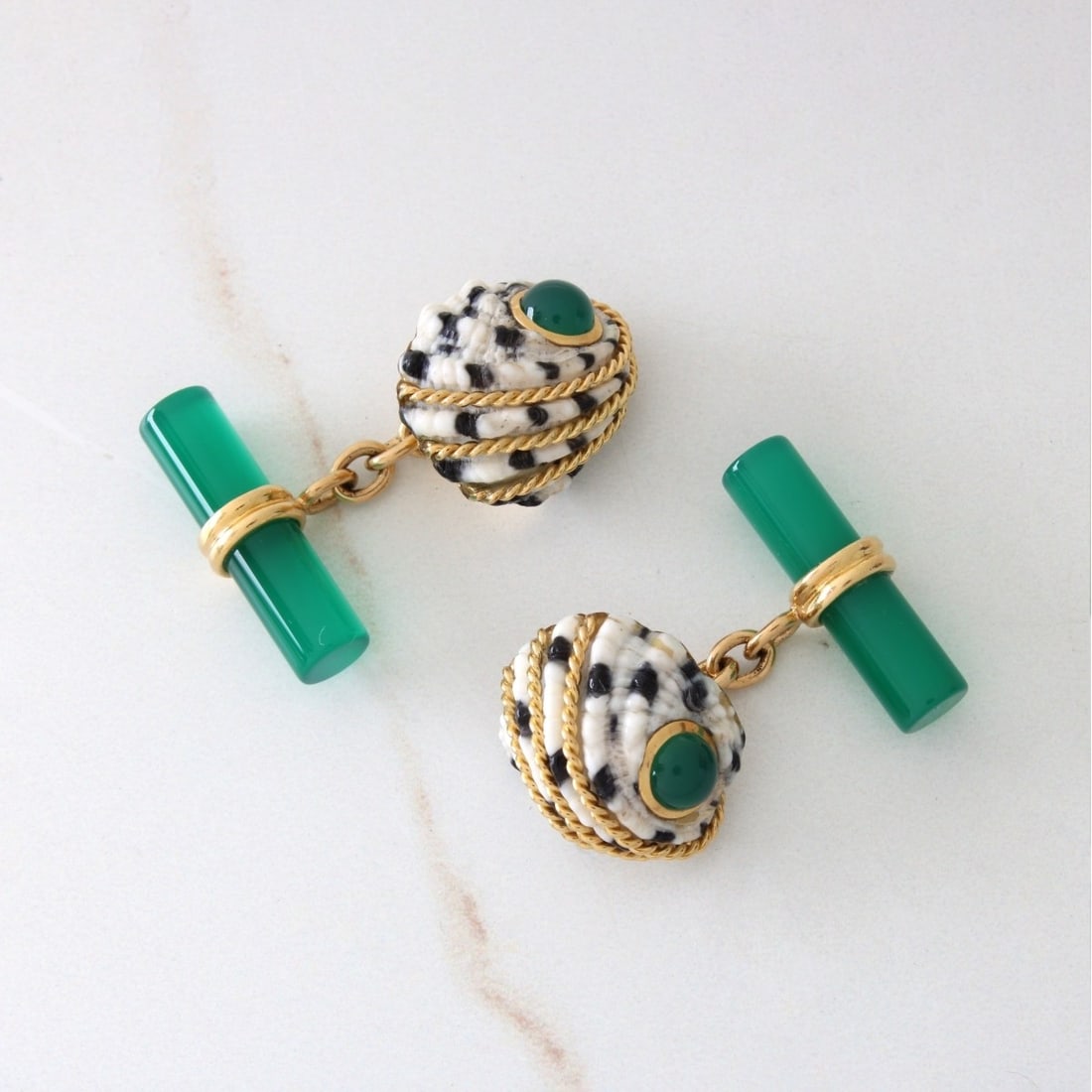 Seaman Schepps Cufflinks: Vintage Seaman Schepps Chrysoprase, Coral, Black Onyx and 18 Karat Yellow Gold Cufflinks. Signed, stamped 750. Measure 5/8" x 1/2". Approx. total weight: 10.21 grams. Kodner Galleries offers phone