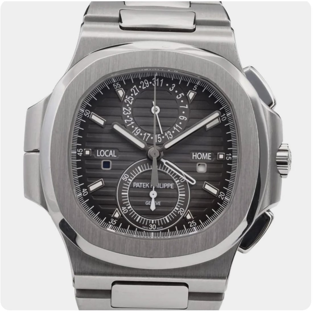 Patek Philippe Nautilus: Patek Philippe Nautilus Travel Time Chronograph Flyback 5990/1A-001 Stainless Steel, Grey Dial. Automatic self-winding movement. Case measures 40.5mm. Complete with box and papers. Condition: Very