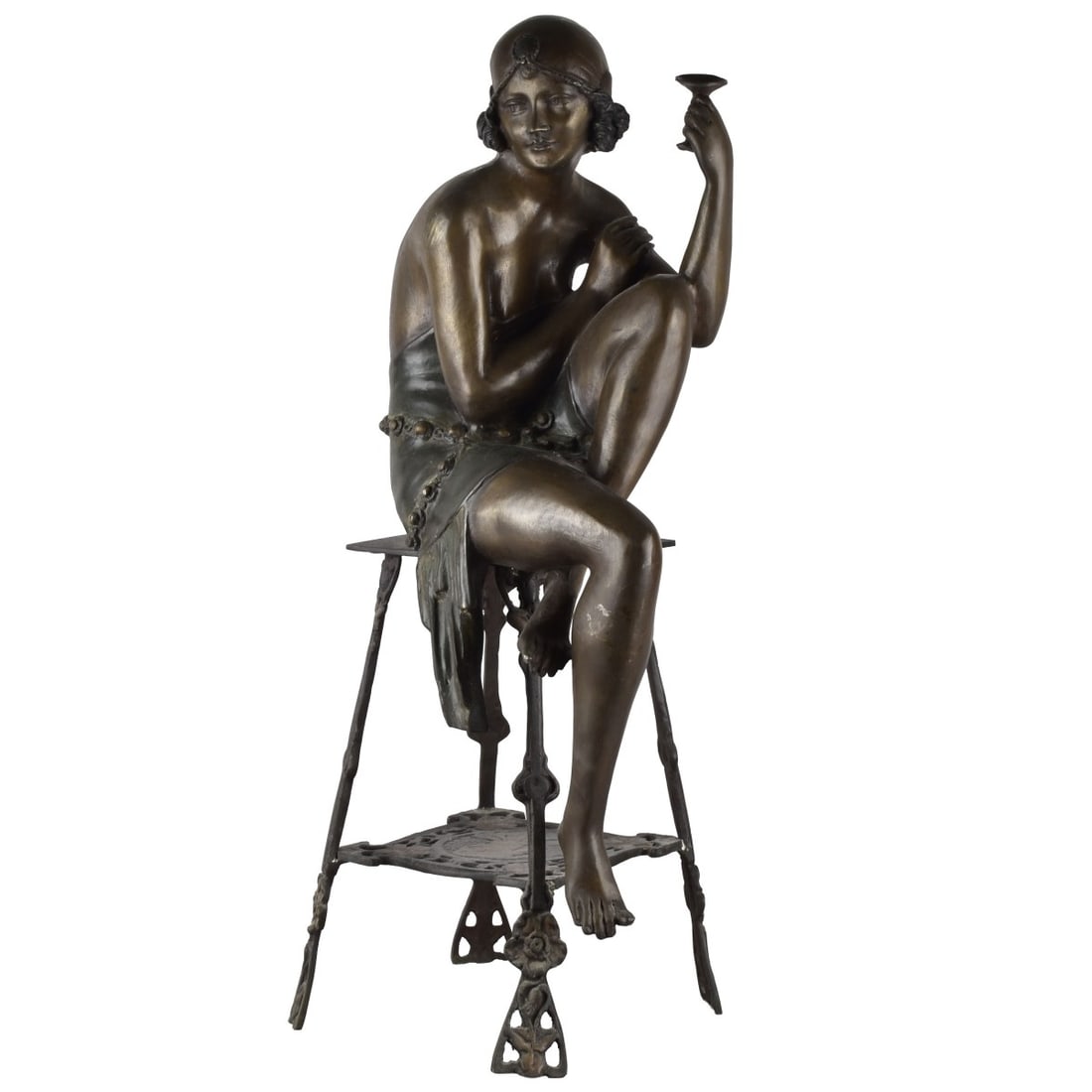 Style of J. E. Mir, (19-20th Century): Style of J. E. Mirr, (19-20th Century) "Champagne Lady" Bronze Sculpture. Depicting an art deco flapper woman wearing a beaded dress and hat and seated on a stool drinking a glass of champagne.