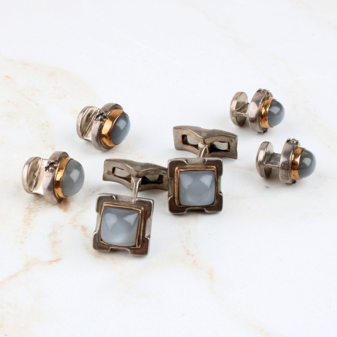 Moonstone and Sterling Dress Shirt Set: Vintage Michael Dawkins Gold Tipped Moonstone and Sterling Silver Cufflinks and Shirt Studs Set. Signed, stamped 925. Cufflinks measure 1/2" square, shirt studs measure 1/2" x 3/8". Approx. total