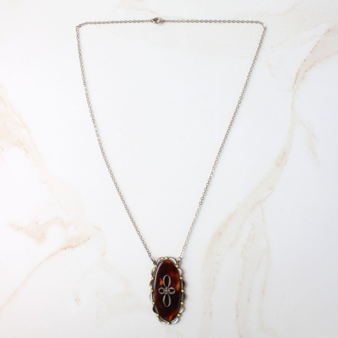 Shell and Sterling Pendant Necklace: Antique Continental Natural Shell, Enamel and Sterling Silver Pendant Necklace. Pendant stamped Sterling and FS maker's mark. Pendant measures 1-5/8" L, 7/8" W; chain measures 18" L. Approx. weight: