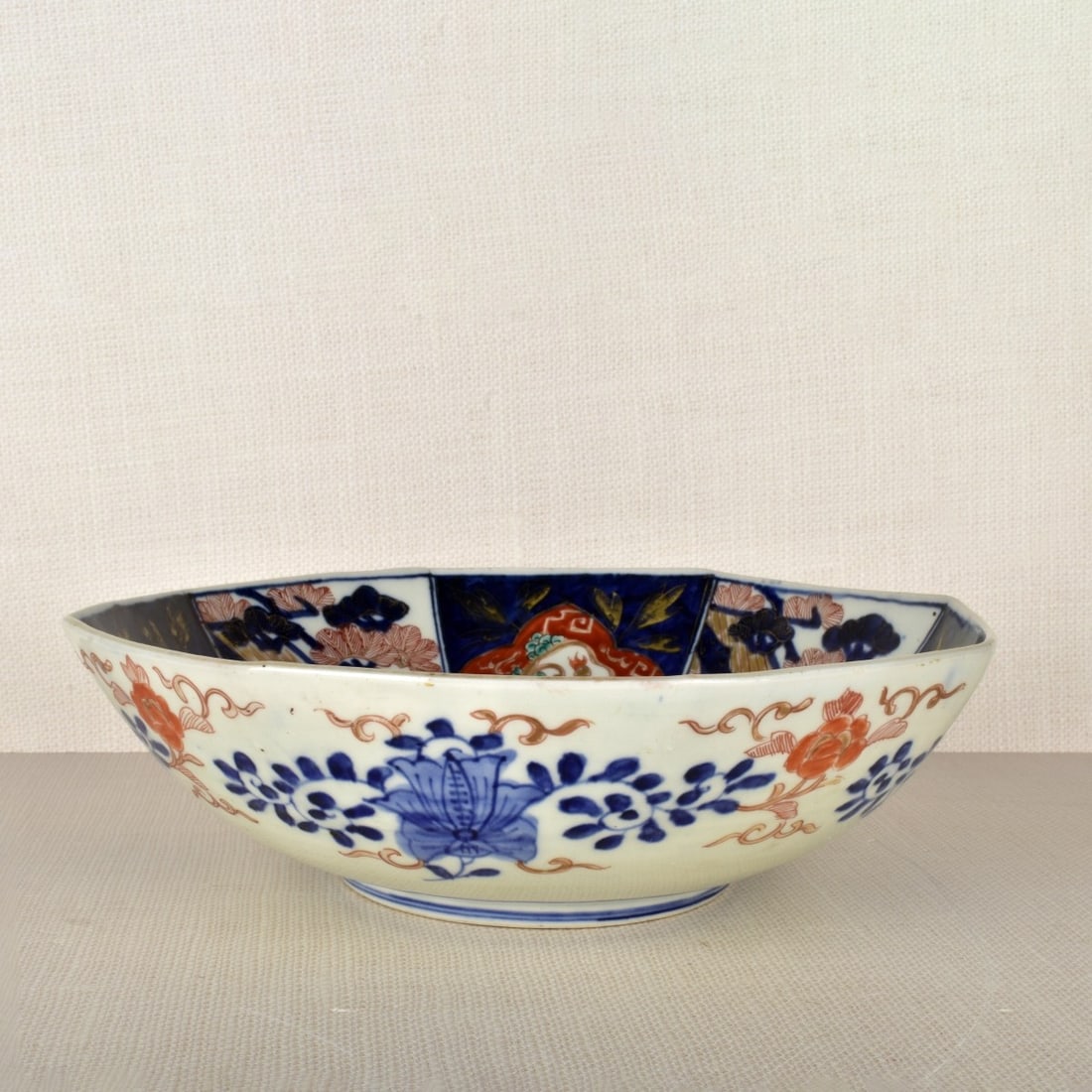 Antique Imari Bowl: Antique Hand Painted Imari Japanese Octagonal Bowl with a Raised Bottom Rim. 20th century. Kodner Galleries offers phone and absentee bidding at a low, flat 21% buyer’s premium without surcharge or