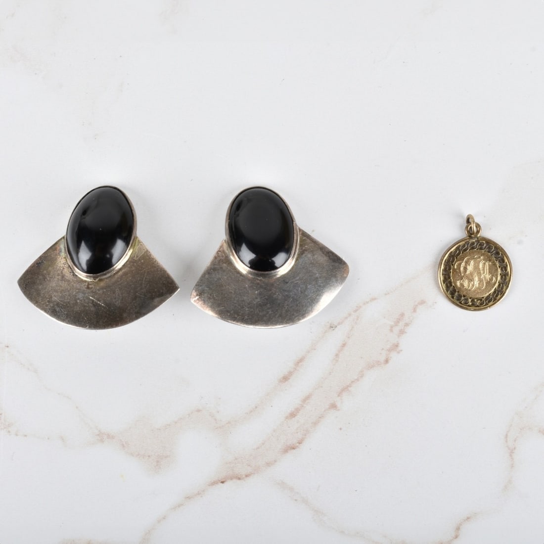 Gold Filled Pendant and Silver Earrings: Vintage Yellow Gold Filled Pendant together with Mexican Sterling Silver and Black Onyx Earrings. Pendant with monogram and engraved dedication dated 1970. Earrings stamped Mexico 950. Pendant