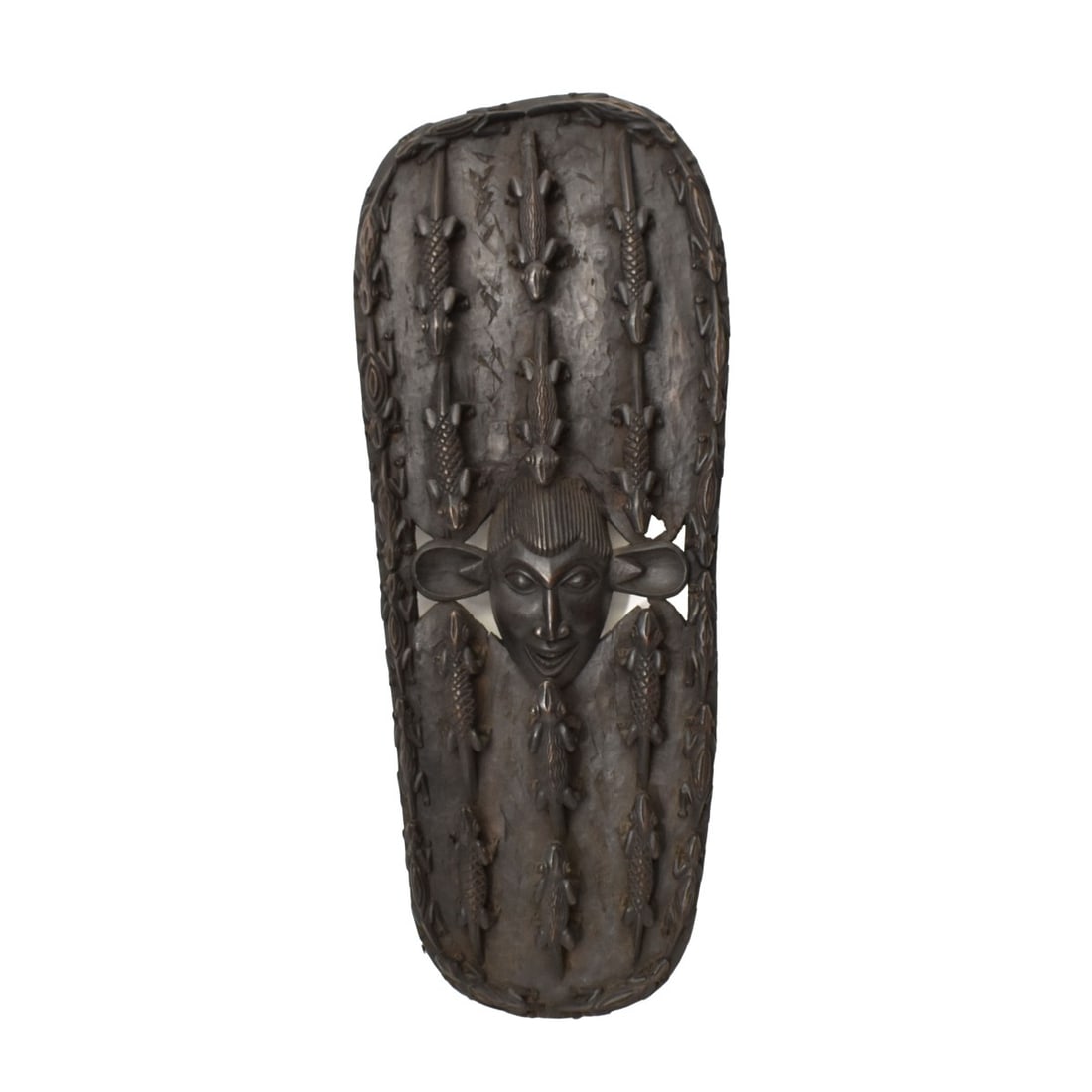 Large African Tribal Hand Carved Wood Wall Art: Large Vintage African Tribal Hand Carved Wood Wall Art with A Central Face and Crocodiles. Measures: 59" H., 23" W., 5-1/2" D. Kodner Galleries offers phone and absentee bidding at a low, flat 21%