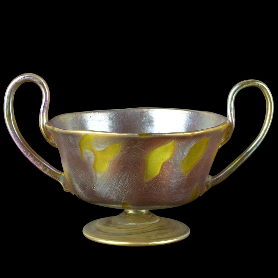 Loetz Art Nouveau Art Glass: Loetz Phanomen Genre Art Glass Two Handle Bowl in Gold with a Polished Pontil. Measures: 4-1/2" high, 5-1/4" diameter. Kodner Galleries offers phone and absentee bidding at a low, flat 21% buyer’s