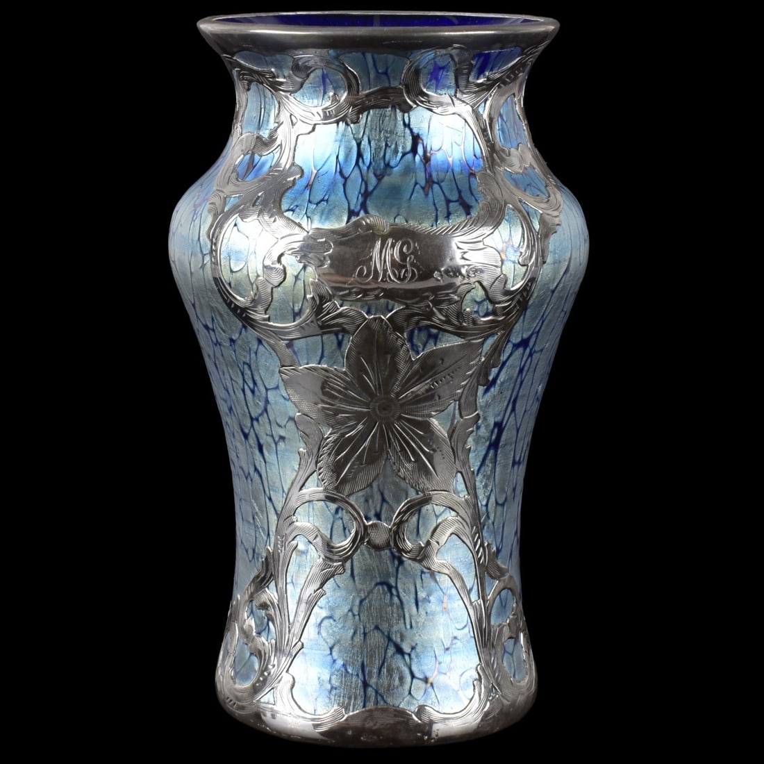 Loetz Art Nouveau Art Glass: Loetz Silver Overlaid Art Glass Vase in Baluster Shape with a Slightly Wider Upwards Form. Measures: 5-5/8" high, 3" diameter. Kodner Galleries offers phone and absentee bidding at a low, flat 21%