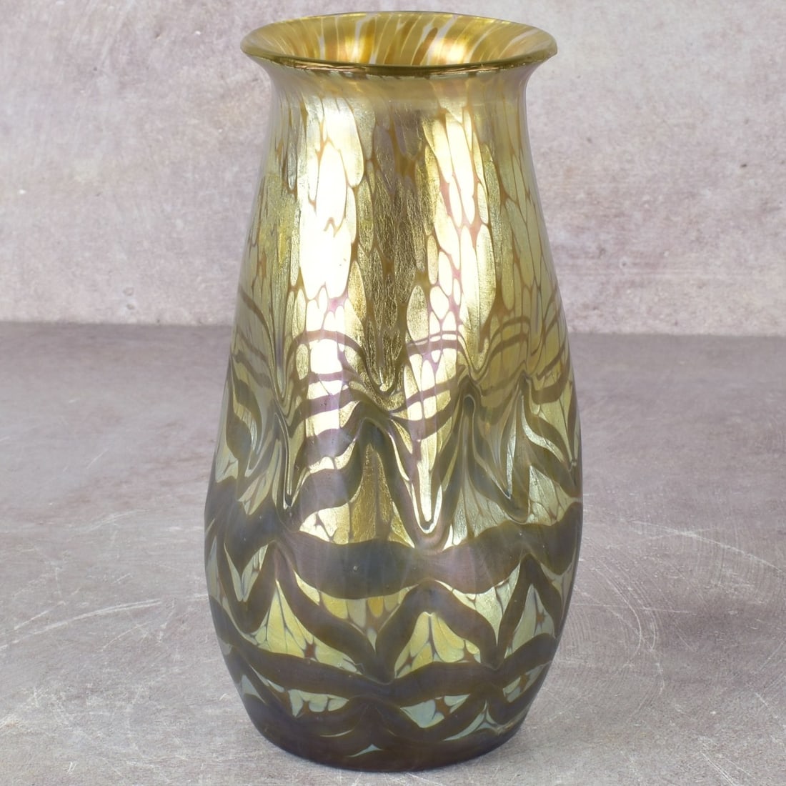 Loetz Art Nouveau Art Glass: Loetz Art Glass Vase in Iridescent Green and Gold Glass with Pinched Sides and a Polished Pontile. Measures: 6-1/2" high, 3-1/4" diameter. Kodner Galleries offers phone and absentee bidding at a low,