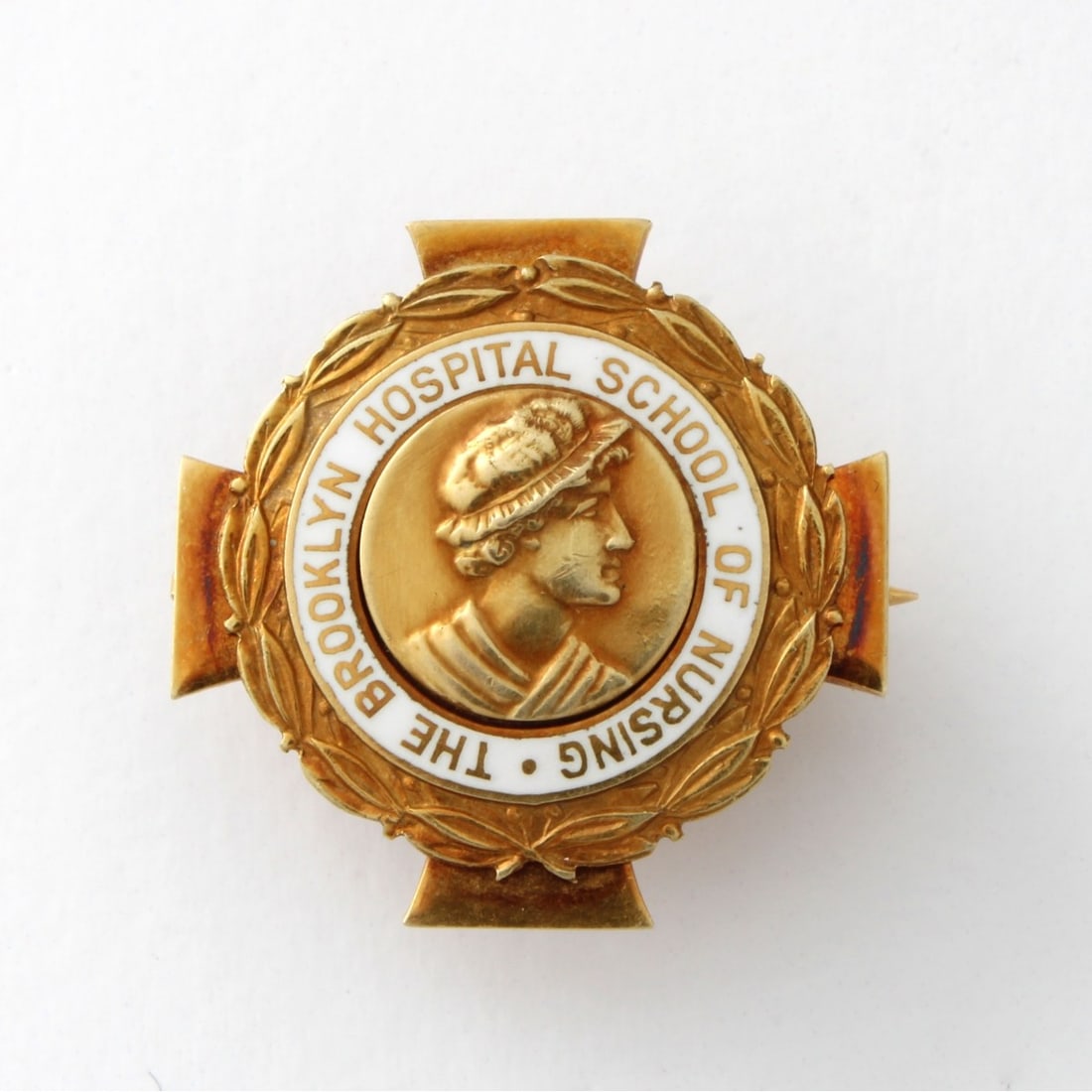 Tiffany & Co 14K Pin: Vintage Tiffany & Co 14 Karat Yellow Gold Award Pin for The Brooklyn Hospital School of Nursing. Signed, stamped 14K. Measures 15/16" x 15/16". Approx. weight: 8.20 grams. Kodner Galleries offers